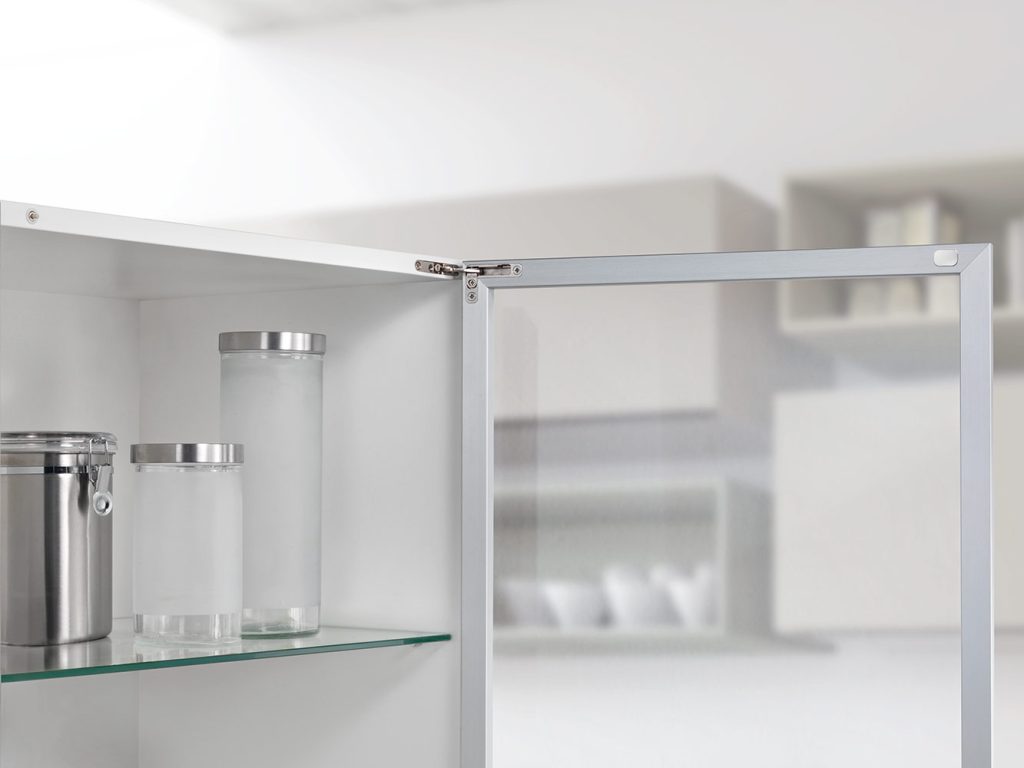 Salice Air hinges used with a glass cabinet door with aluminum frame