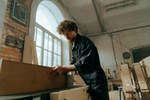 A woodworker working on a piece in his cabinet shop